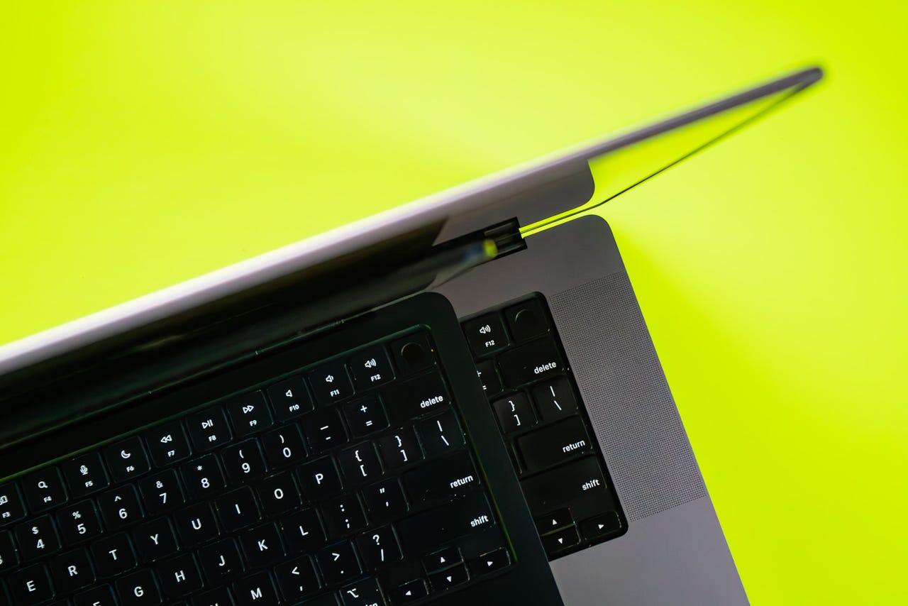 MacBook Air and MacBook Pro on Energy Yellow background